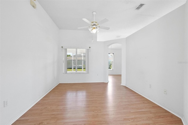 710 Independence Dr, Orange City, FL 32763 - unfurnished room featuring arched walkways, light wood-style floors, and ceiling fan