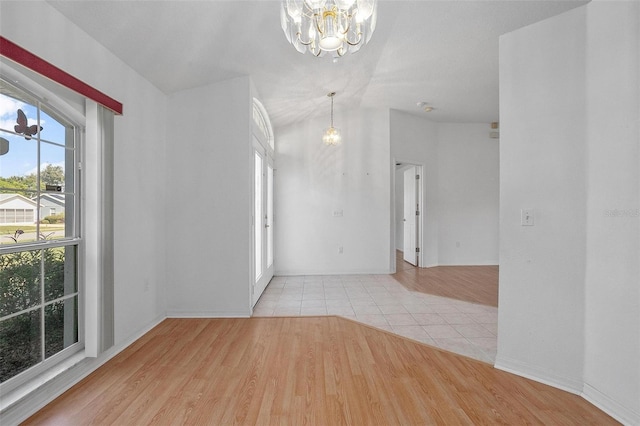 710 Independence Dr, Orange City, FL 32763 - empty room with a chandelier and wood finished floors