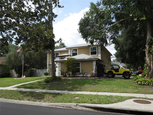 1420 Center St, Ocoee, FL 34761 - view of front of property with stucco siding and a front lawn