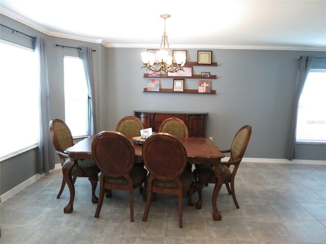 1420 Center St, Ocoee, FL 34761 - dining space featuring a chandelier and ornamental molding
