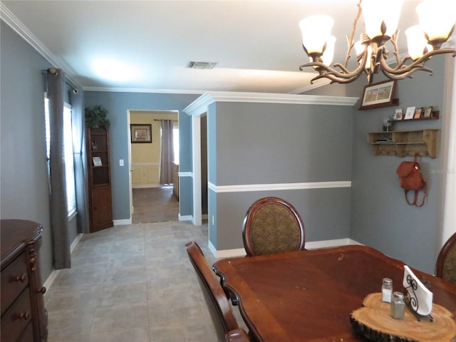 1420 Center St, Ocoee, FL 34761 - dining space featuring a chandelier and ornamental molding