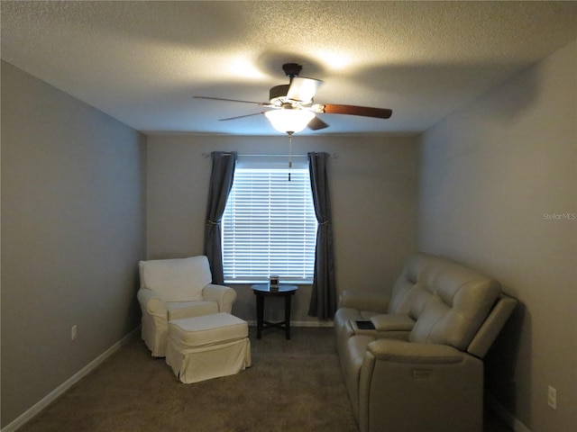 1420 Center St, Ocoee, FL 34761 - sitting room with a ceiling fan, carpet, and a textured ceiling