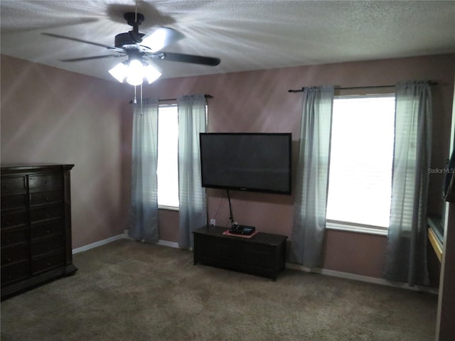 1420 Center St, Ocoee, FL 34761 - unfurnished living room with a ceiling fan, carpet, and a textured ceiling