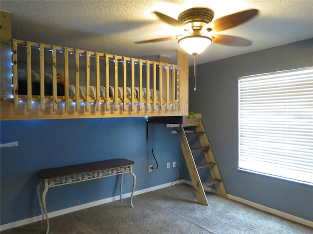 1420 Center St, Ocoee, FL 34761 - unfurnished bedroom featuring multiple windows, carpet flooring, and a textured ceiling
