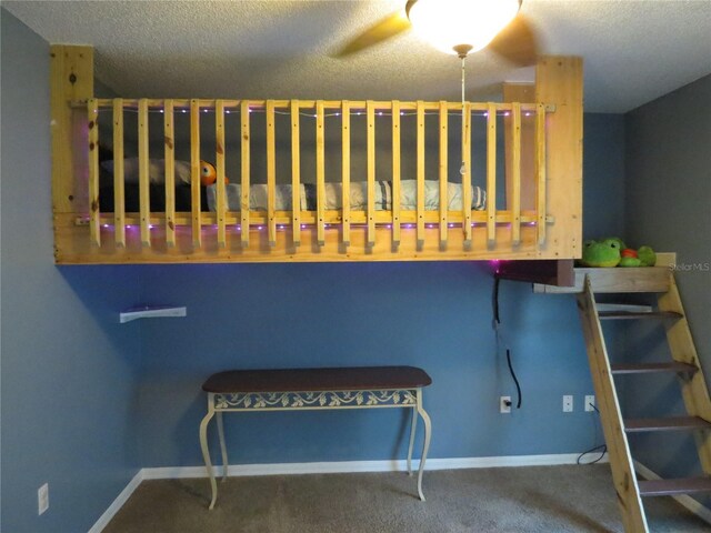 1420 Center St, Ocoee, FL 34761 - carpeted bedroom with a textured ceiling and baseboards