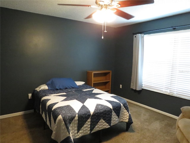 1420 Center St, Ocoee, FL 34761 - carpeted bedroom with a ceiling fan and baseboards