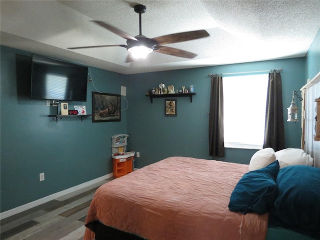 1420 Center St, Ocoee, FL 34761 - bedroom with wood finished floors, a textured ceiling, and ceiling fan