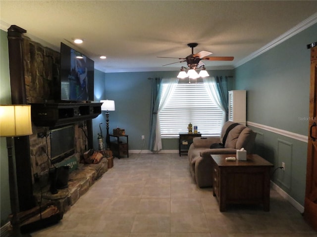 1420 Center St, Ocoee, FL 34761 - living area with ceiling fan, ornamental molding, a stone fireplace, and light tile patterned flooring