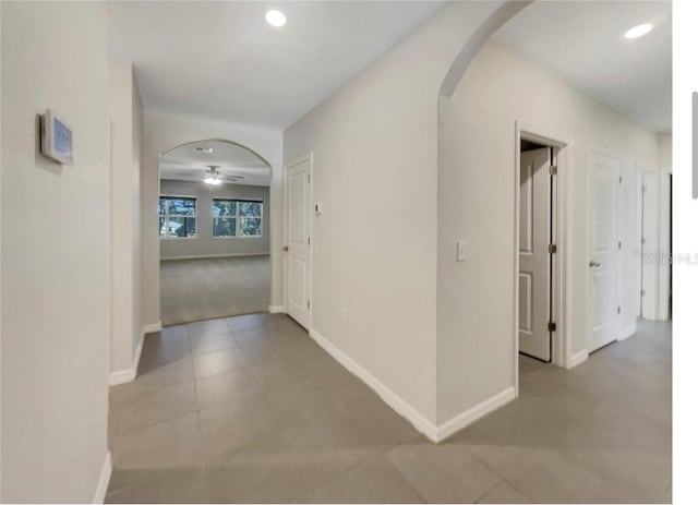 133 Hickory Course Cir, Ocala, FL 34472 - corridor featuring arched walkways, recessed lighting, and tile patterned floors