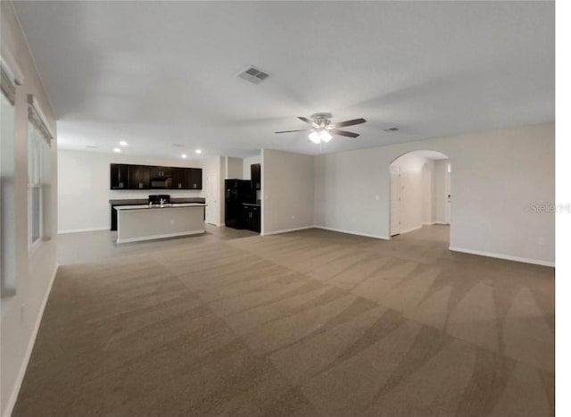 133 Hickory Course Cir, Ocala, FL 34472 - unfurnished living room with a ceiling fan, carpet, arched walkways, and recessed lighting