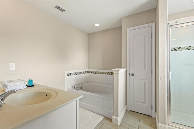 5368 Oakbourne Ave, Davenport, FL 33837 - full bath featuring a stall shower, a garden tub, tile patterned floors, vanity, and recessed lighting