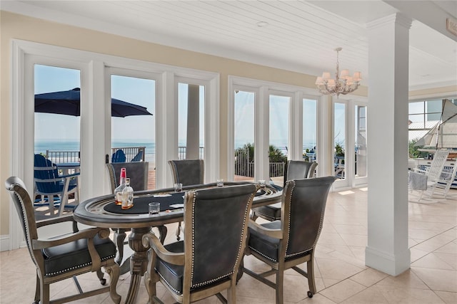 3309 Hill St, New Smyrna Beach, FL 32169 - dining area with a chandelier and light tile patterned floors