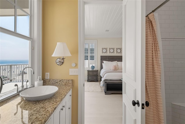 3309 Hill St, New Smyrna Beach, FL 32169 - bathroom with vanity, a shower with shower curtain, ensuite bath, and a water view