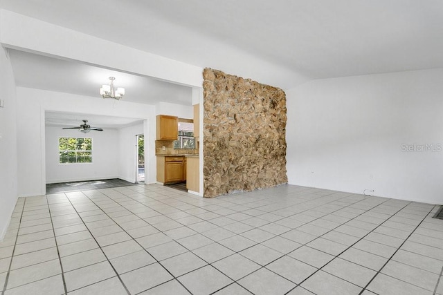 1148 Northcrest Dr, Apopka, FL 32703 - unfurnished living room featuring a chandelier, vaulted ceiling, light tile patterned floors, and ceiling fan