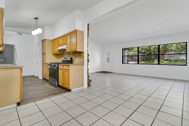 1148 Northcrest Dr, Apopka, FL 32703 - kitchen featuring stainless steel appliances, under cabinet range hood, open floor plan, decorative backsplash, and light tile patterned floors