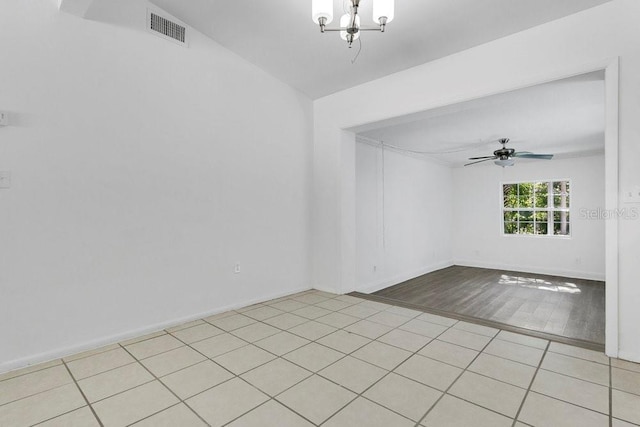 1148 Northcrest Dr, Apopka, FL 32703 - unfurnished room featuring a chandelier, ceiling fan, and light tile patterned flooring