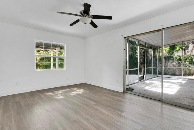 1148 Northcrest Dr, Apopka, FL 32703 - empty room with a ceiling fan, wood finished floors, and ornamental molding