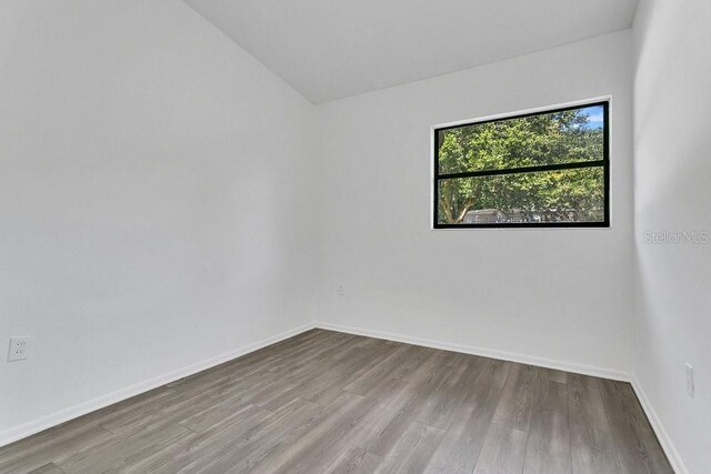 1148 Northcrest Dr, Apopka, FL 32703 - unfurnished room with wood finished floors and vaulted ceiling