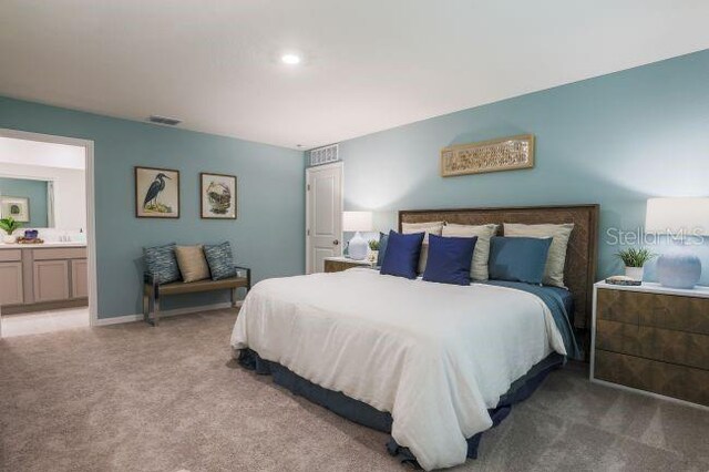 224 Locust Pass Crse, Ocala, FL 34472 - bedroom with light carpet and ensuite bath