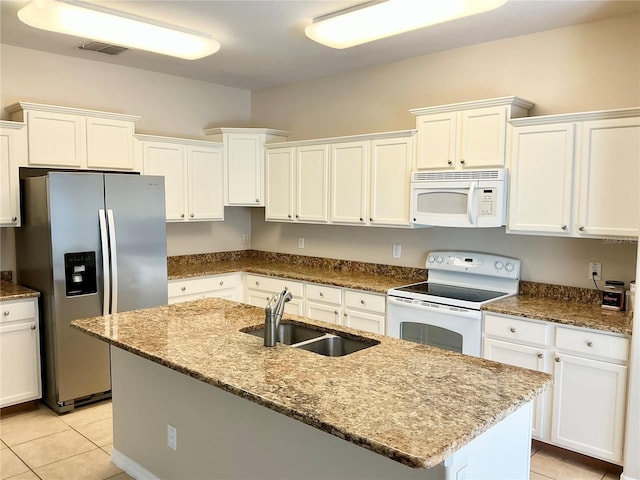 5917 Coquyt Dr, Mount Dora, FL 32757 - kitchen with white appliances, white cabinetry, and light tile patterned floors
