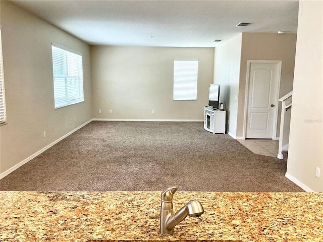 5917 Coquyt Dr, Mount Dora, FL 32757 - unfurnished living room featuring carpet floors and baseboards