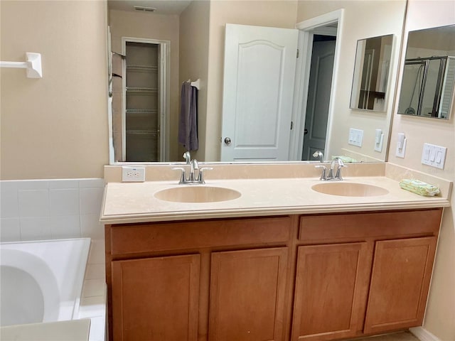 5917 Coquyt Dr, Mount Dora, FL 32757 - bathroom featuring double vanity and a bath