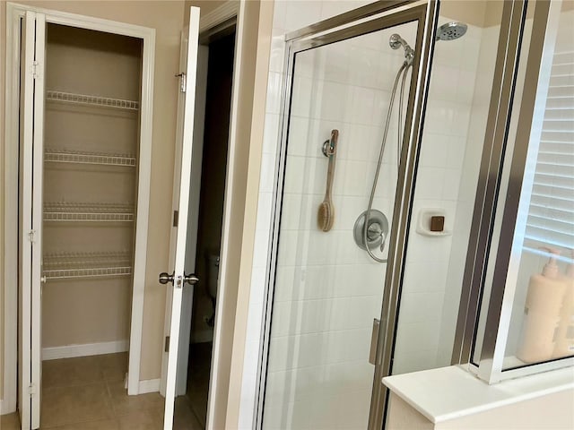 5917 Coquyt Dr, Mount Dora, FL 32757 - full bath with a stall shower, a walk in closet, and tile patterned flooring