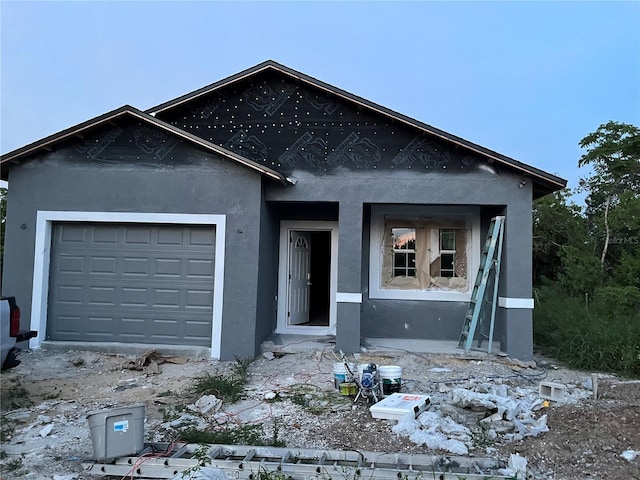 134 W Northside Dr, Lake Wales, FL 33853 - view of front of property featuring stucco siding and an attached garage