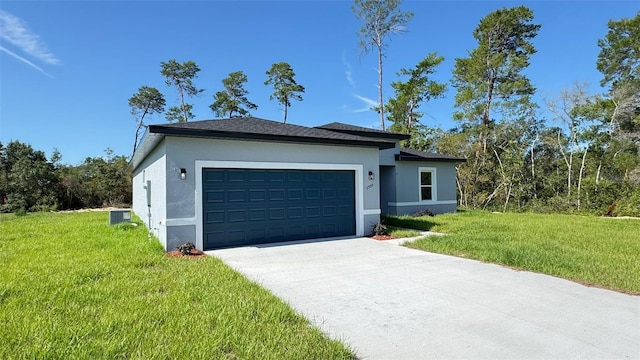 2500 SW 156th Ln Rd, Ocala, FL 34473 - view of front of property featuring stucco siding, a garage, concrete driveway, and a front lawn