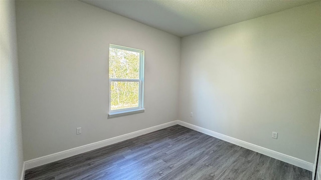 2500 SW 156th Ln Rd, Ocala, FL 34473 - empty room featuring dark wood-style floors and baseboards