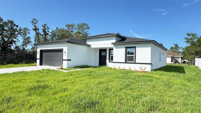 16252 SW 27th Terrace Rd, Ocala, FL 34473 - prairie-style home with an attached garage, a front lawn, concrete driveway, and stucco siding