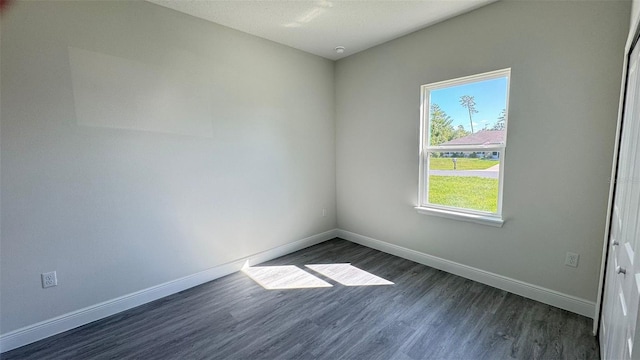 16252 SW 27th Terrace Rd, Ocala, FL 34473 - empty room with baseboards and dark wood-style floors