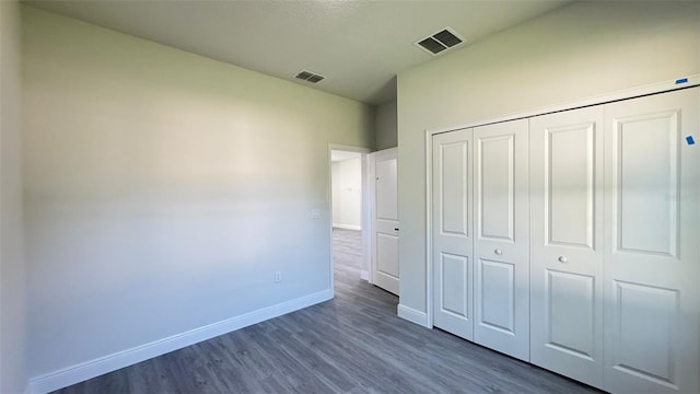 16252 SW 27th Terrace Rd, Ocala, FL 34473 - unfurnished bedroom featuring dark wood-style floors and a closet