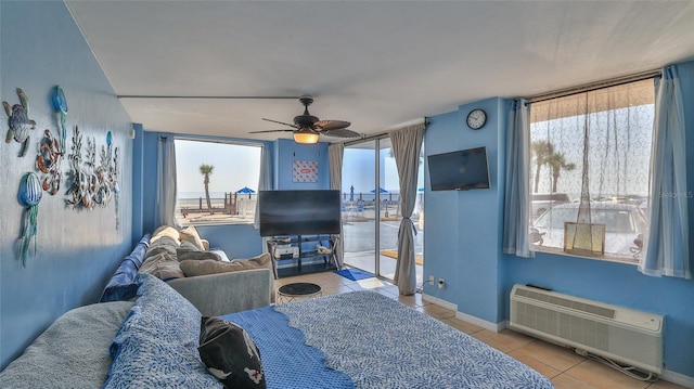 1233 N Atlantic Ave Unit 1020, Daytona Beach, FL 32118 - tiled bedroom with access to outside and ceiling fan