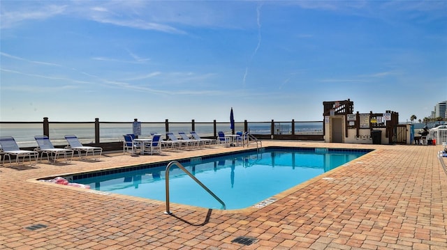 1233 N Atlantic Ave Unit 1020, Daytona Beach, FL 32118 - community pool with a patio and a water view