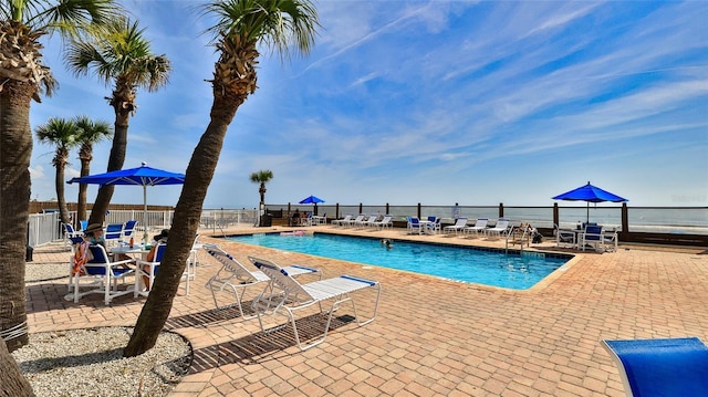 1233 N Atlantic Ave Unit 1020, Daytona Beach, FL 32118 - community pool featuring a patio area