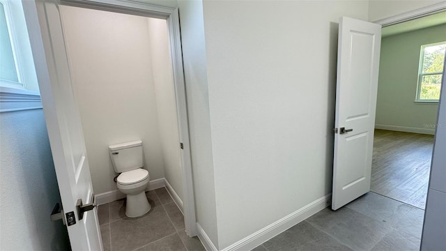 742 W Glenhaven Dr, Citrus Springs, FL 34434 - bathroom featuring toilet and tile patterned flooring