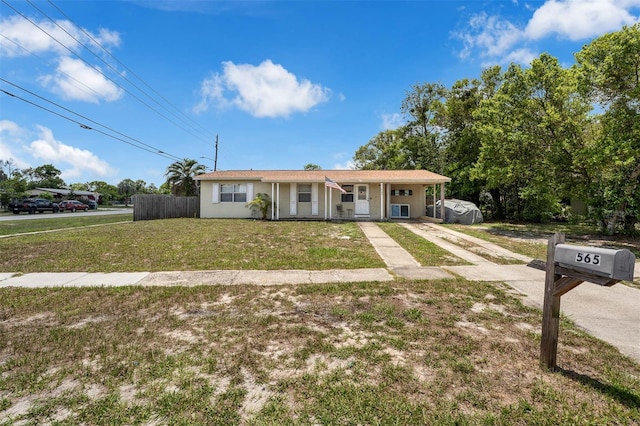 565 S Floyd Cir, Deltona, FL 32725 - single story home with driveway