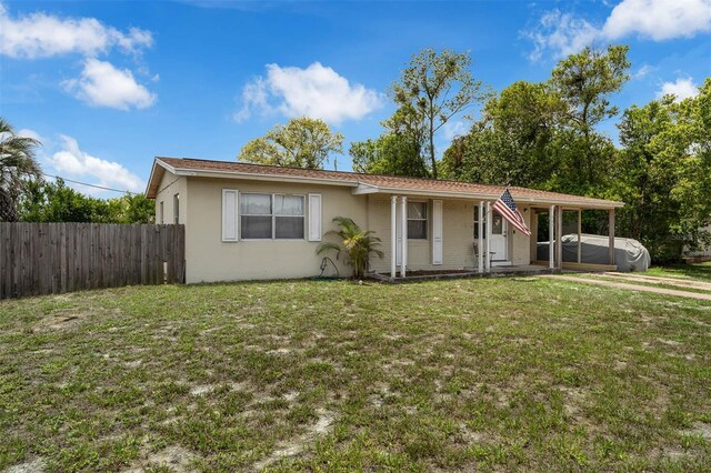 565 S Floyd Cir, Deltona, FL 32725 - view of front facade with stucco siding