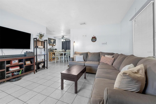 565 S Floyd Cir, Deltona, FL 32725 - living room with light tile patterned floors and ceiling fan