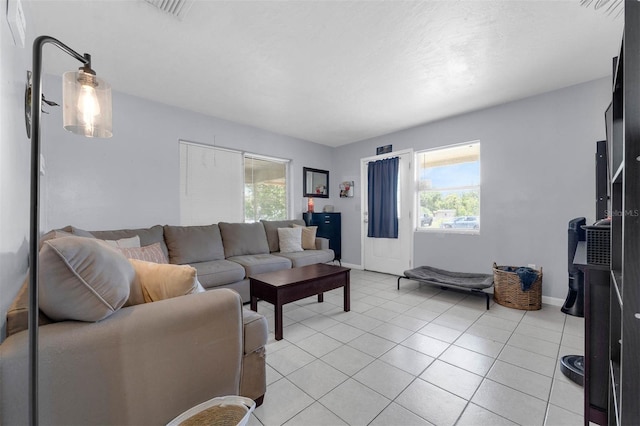 565 S Floyd Cir, Deltona, FL 32725 - living room with healthy amount of natural light and light tile patterned flooring
