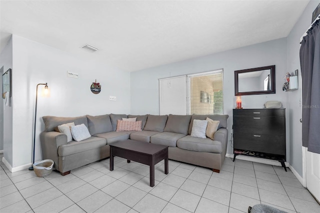 565 S Floyd Cir, Deltona, FL 32725 - living room featuring baseboards and light tile patterned floors