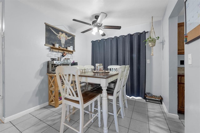 565 S Floyd Cir, Deltona, FL 32725 - dining room with light tile patterned floors and a ceiling fan