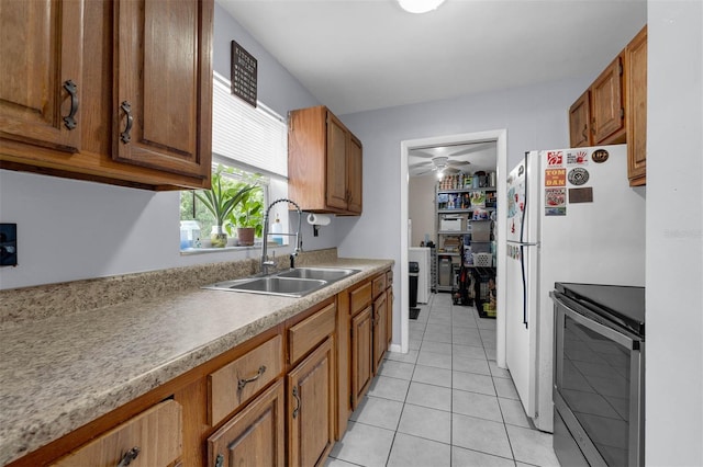 565 S Floyd Cir, Deltona, FL 32725 - kitchen featuring stainless steel range with electric stovetop and brown cabinetry