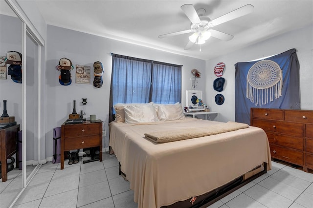 565 S Floyd Cir, Deltona, FL 32725 - bedroom with light tile patterned floors, ceiling fan, and a closet