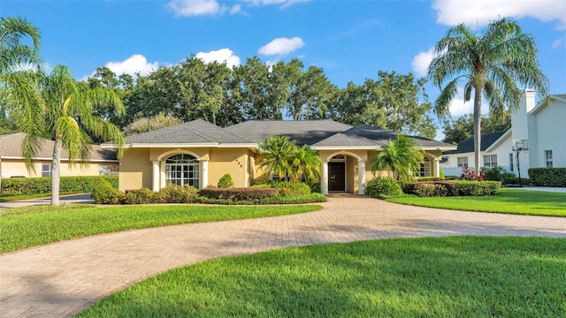 1455 Royal Forest Loop, Lakeland, FL 33811 - ranch-style house featuring stucco siding and a front yard