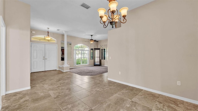1455 Royal Forest Loop, Lakeland, FL 33811 - entryway featuring a chandelier, decorative columns, and a ceiling fan