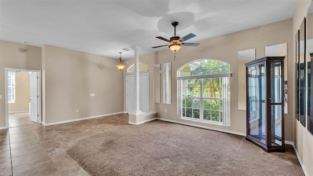 1455 Royal Forest Loop, Lakeland, FL 33811 - unfurnished living room with ceiling fan and ornate columns
