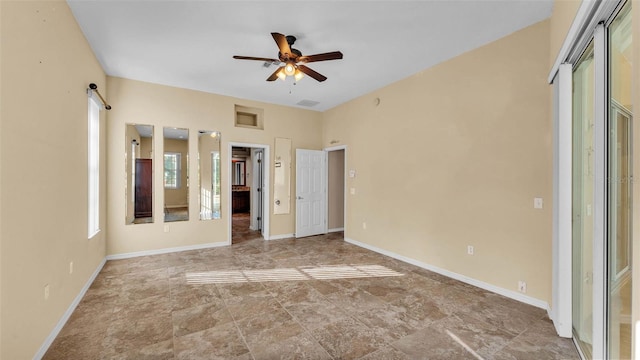 1455 Royal Forest Loop, Lakeland, FL 33811 - unfurnished bedroom with baseboards and ceiling fan