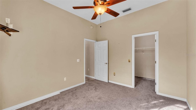 1455 Royal Forest Loop, Lakeland, FL 33811 - unfurnished bedroom with carpet floors, a walk in closet, a closet, and ceiling fan